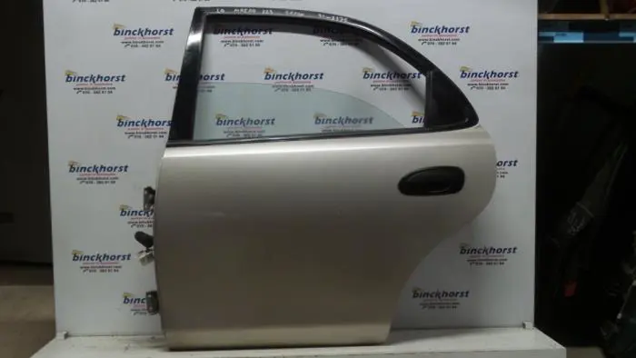 Rear door 4-door, left Mazda 323