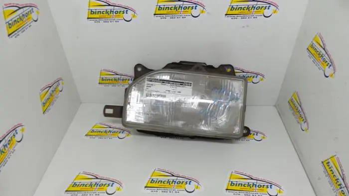 Headlight, left Mazda 121