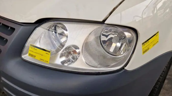 Headlight, left Volkswagen Caddy