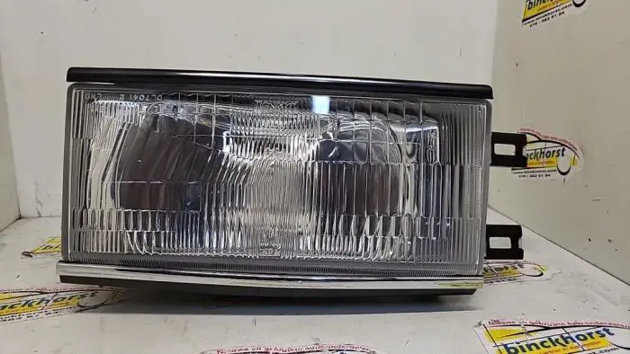 Headlight, left Nissan Bluebird